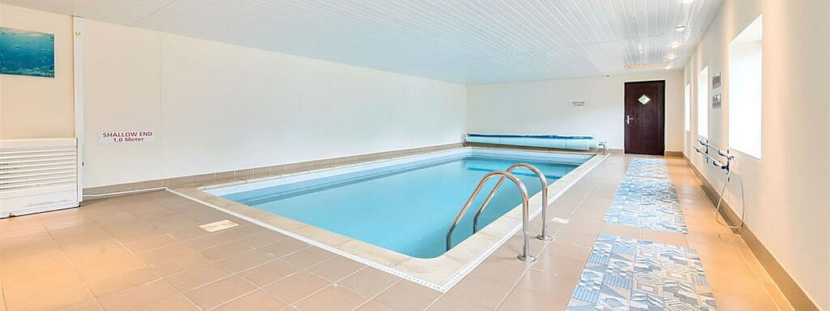 Shared heated indoor pool and hot tub at Lower Pencubitt Holiday Cottages